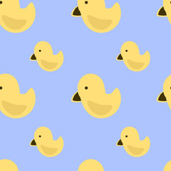 Vector seamless pattern of yellow ducks on a blue background. Drawn by hand in cartoon style, use for scrapbooking, printing on fabric, stationery design