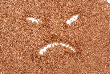 texture of dry brown flax seeds, top view, full frame