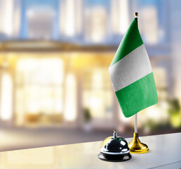 Nigeria flag on the reception desk in the lobby of the hotel