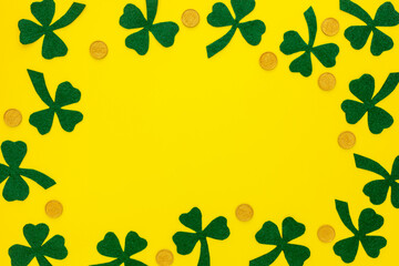 Composition for St. Patrick's Day. Decorating paper with green clover or shamrocks and gold coins