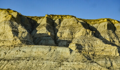 Geological stony-clay landscape, mountains and rocks in the evening at sunset. North Dakota