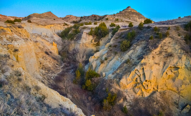 Geological stony-clay landscape, mountains and rocks in the evening at sunset. North Dakota