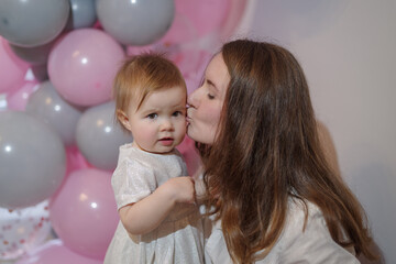Mother and daughter at her first birthday party