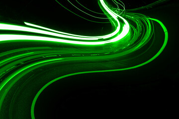 green car lights at night. long exposure