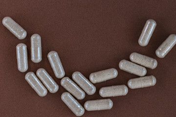 close-up of slippery elm capsules. dietary concept. dietary supplement topview.