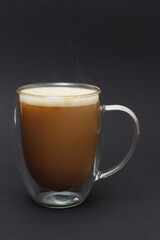Glass Cup of coffee latte on dark