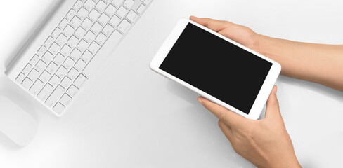 Hands holding  tablet touch computer gadget with  screen