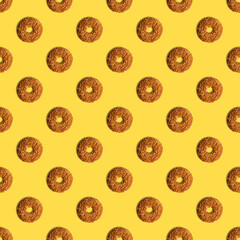 Cookies template with sesame seeds on a yellow background. View from above. Creative design, minimal flat lay concept.
