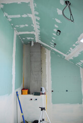 Attic conversion, remodel into a bathroom. Bathroom installation in the attic with construction of moisture-resistant drywall, plastering, electrical wires, plumbing pipes, ventilation installation.