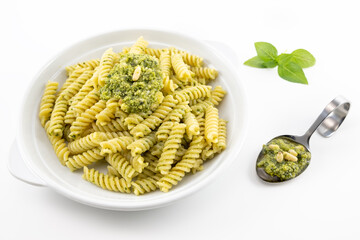 Pasta with pesto, basil leaves with white background
