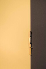 Medication yellow round tablets, pills arranged abstract on yellow and grey background. Medical...