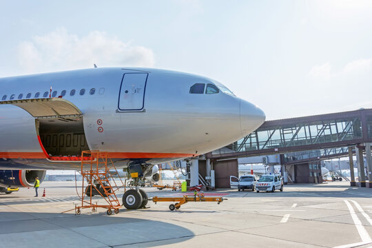 Preflight service, aircraft maintenance, baggage is loading into the luggage compartment of the aircraft at the airport.
