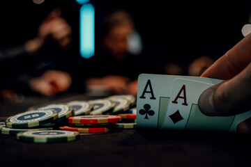 the poker game in casino chips cards and the poker table - obrazy, fototapety, plakaty