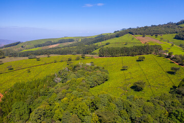 Panoramic aerial view of a tea estate in Malawi with the Shire River Valley in the far distance.