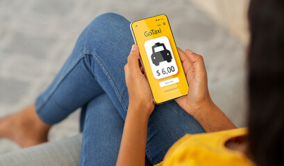 Best mobile taxi app. Unrecognizable black woman using modern application, ordering cab on phone, paying for service