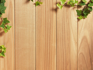 An Ivy plant on a table of hardwood