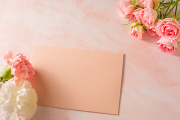 Mother's day concept. Pink rose carnation and letter.