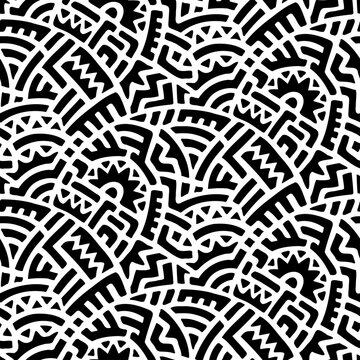 Seamless black and white tribal pattern. Ornament for textiles in patchwork style. Doodle hand drawn ink print. Vector illustration.