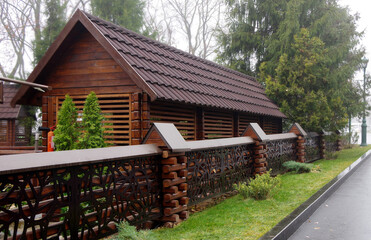 Wooden pavilion and tile roof in Odyha city park. Summer rest. Selective focus.
