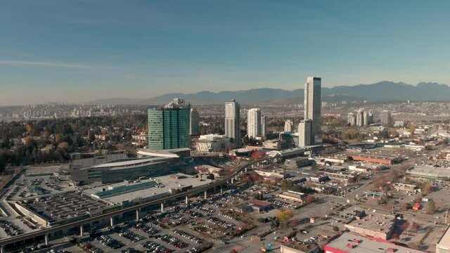 Drone 4K Footage Above Surrey panoramic shot of a city center of high rise buildings downtown cityscape maintaining air quality