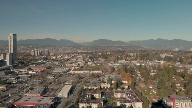 Drone 4K Footage Dramatic cityscape with highrise buildings train track roads and parking lots with traffic congestion and pollution