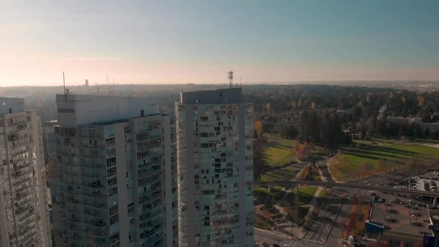 Drone 4K Footage Above Surrey panoramic shot of a city center of a few highrise downtown cityscape buildings maintaining air quality