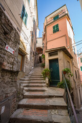 Walking narrow streets of Vernazza village in Cinque Terre on the Italian Riviera