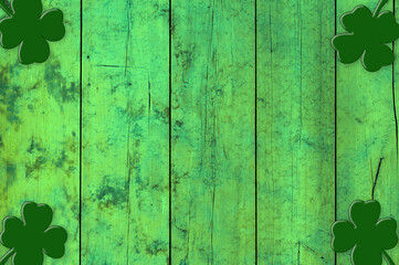 St Patricks day background. Shamrocks over a green wood background