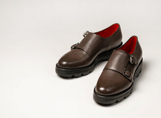 Women's leather shoes with red lining and two buckles