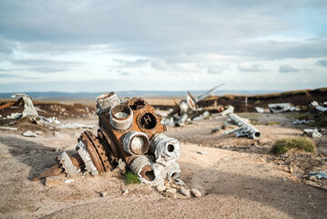 Abandoned B29 WW2 American Airforce Bomber Overexposed crash site on Bleaklow Moor with rusty aircraft engine parts and aeroplane landing gear wheels wreckage strewn across Peak District landscape 
