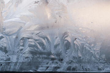 White wintry hoarfrost background on a window