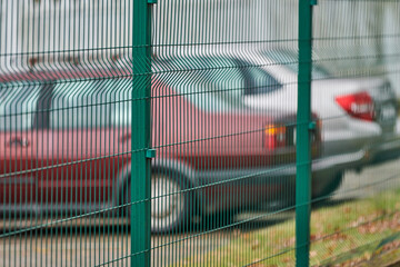 Fenced car parking lot with security