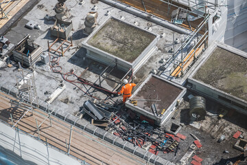 Aerial view of an unidentified worker in construction site in the city of London