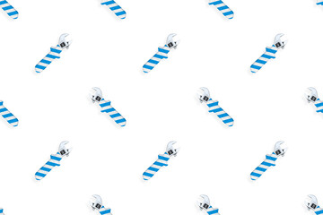Adjustable wrench seamless pattern. Background made of a metal adjustable wrench with a rubber striped handle. 