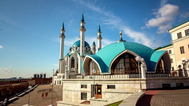 Crowd of tourists walk along square near Kul Sharif mosque