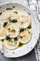 ravioli with mushroom, cream sauce and cheese