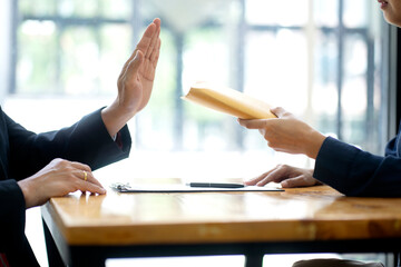 The officer refused to accept the money bribe envelope