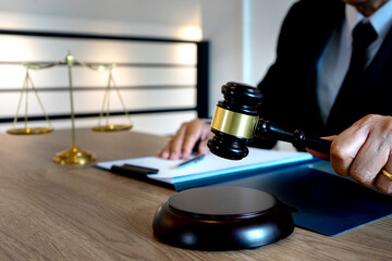 The judge's gavel handle is set to be hammered down © sabthai