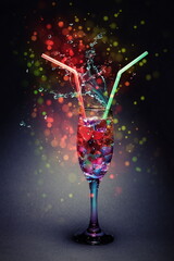 festive still life cocktail for lovers from a glass with hearts with a straw for a wedding or Valentine's day or March 8.