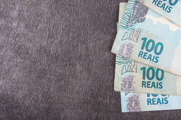 one hundred Brazilian reais banknotes with copy space