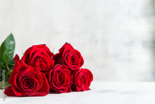Red roses bouquet on a white background. Happy St. Valentine's Day, Mother's Day, Women's Day. Floral background. Greeting card, romantic gift. Copy space