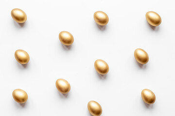 Golden Easter eggs isolated on white background. Top view