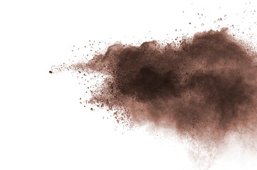 Abstract brown powder explosion. Closeup of brown dust particle splash isolated on white  background
