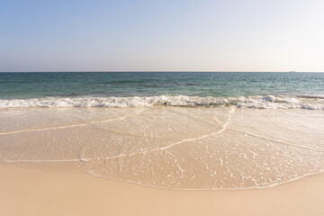 Beach and waves tropical sea with blue sky on sunny day background. copy space