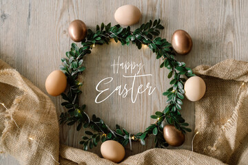 Easter eggs and and green wreath. Congratulatory easter background.