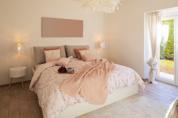 Modern, bright and luxury bedroom in design apartament. Fresh bed sheets and pillows above