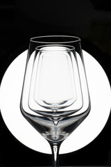 Empty glasses on black and white 