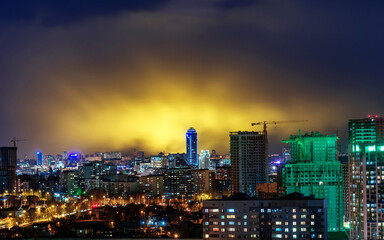 Fototapeta na wymiar Vysotsky building in Yekaterinburg on the background of storm clouds at night 2