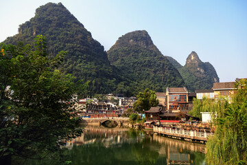 Fototapeta na wymiar View of the cityscape by the lake among the mountains, Guilin, China on August 24, 2019