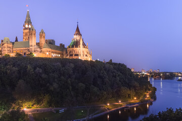 Evening twilight view from Alexandra Bridge Lookout of Parliament Hill and Parliament building in Ottawa, Ontario, capital of Canada.
